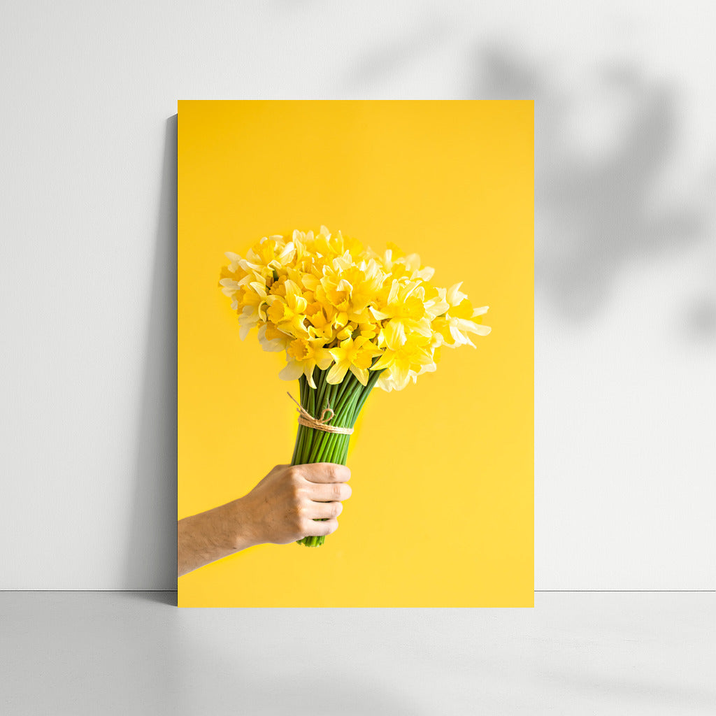 Sunny Daffodils: Male Hand with Bouquet on Bright Background