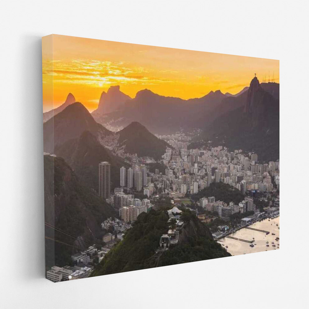 Rio's Sunset Charm: City and Mountains Under Orange Sky