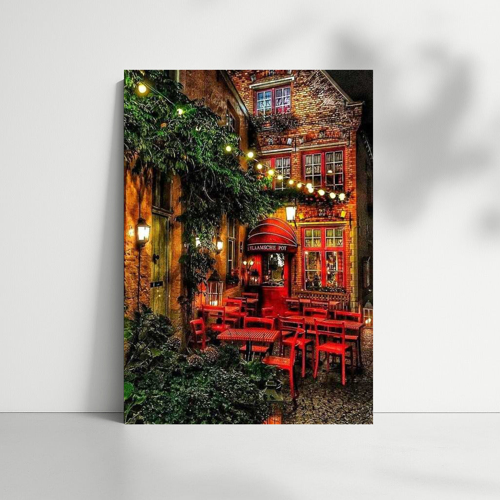 Evening Coziness of a Belgian Courtyard: Red Chairs and Light of Bulbs