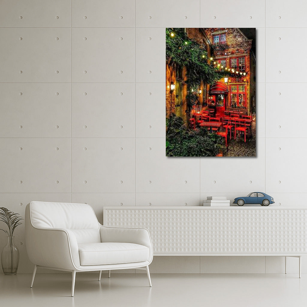 Evening Coziness of a Belgian Courtyard: Red Chairs and Light of Bulbs