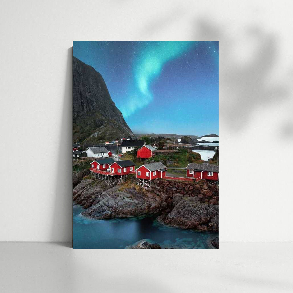 Northern Lights over the Red Houses of Norway: The Atmosphere of Scandinavia