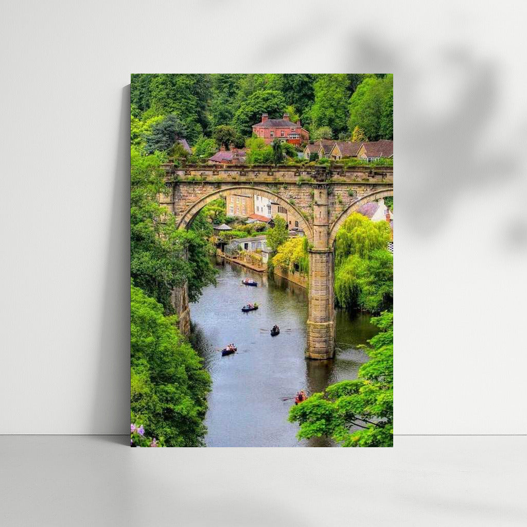 Arch Bridge and Boats: The Charm of the British Landscape
