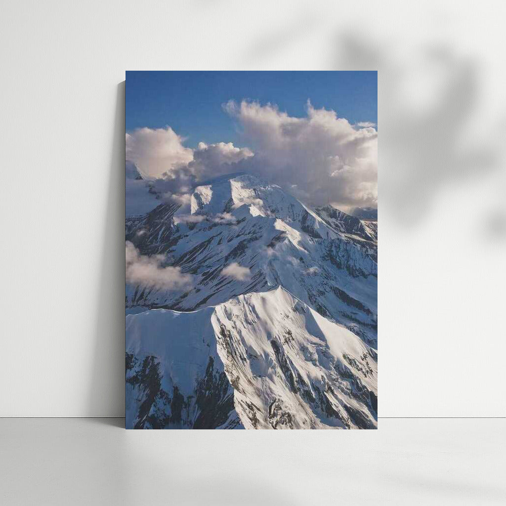Alaska's Grandeur: Snowy Mountains and Clouds USA