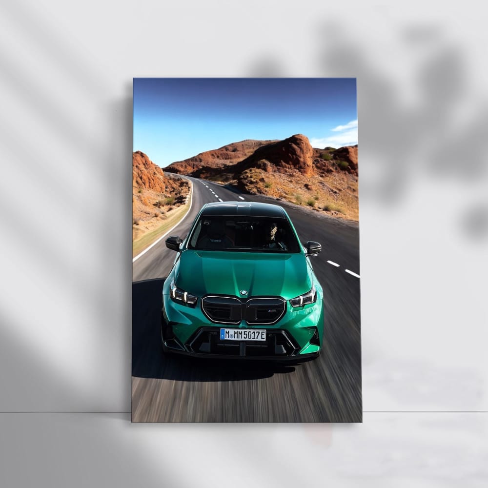 BMW M5 G90 Sedan in Green Cruising on Road - Power and Style