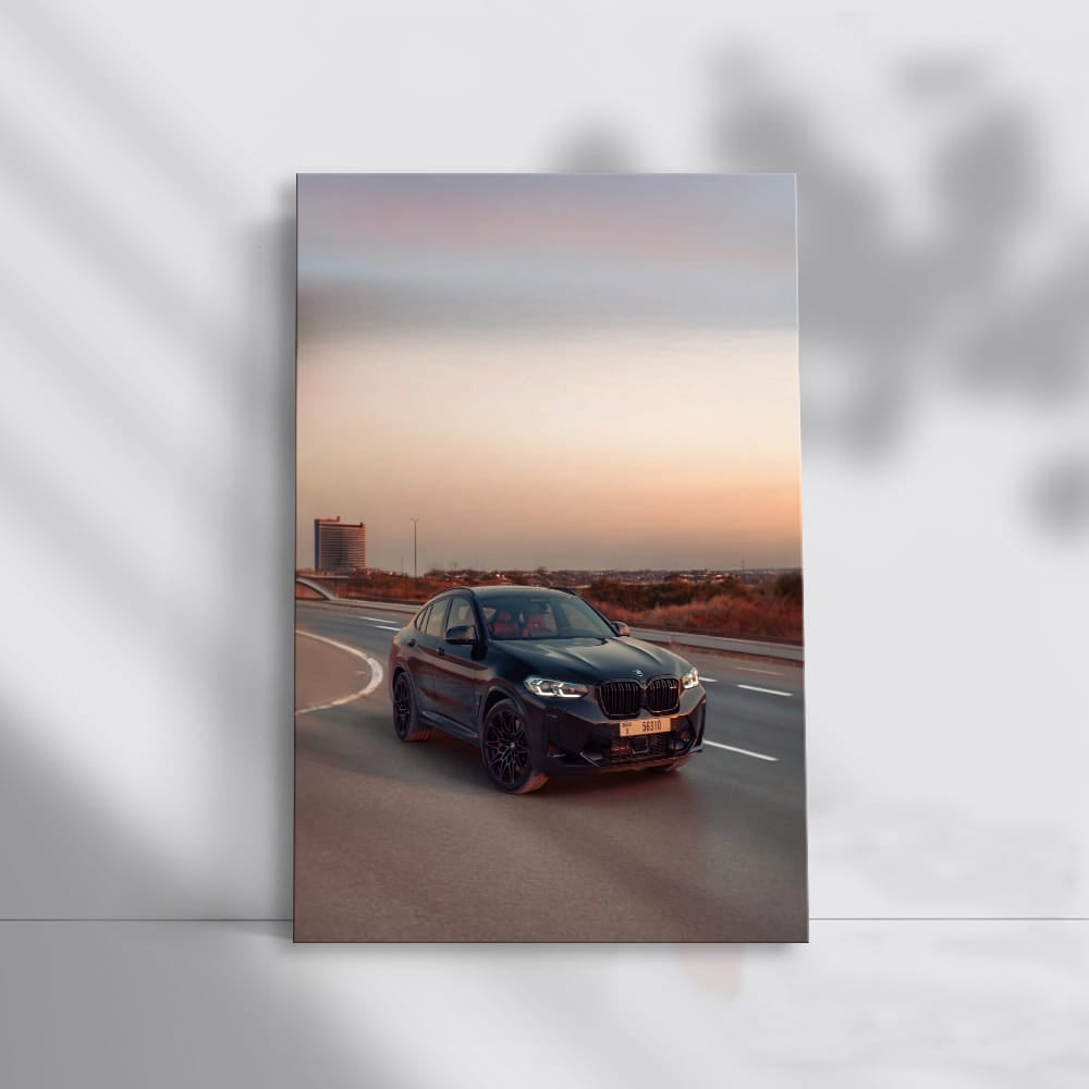 Black BMW X4 M Cruising on Road - Power Meets Elegance
