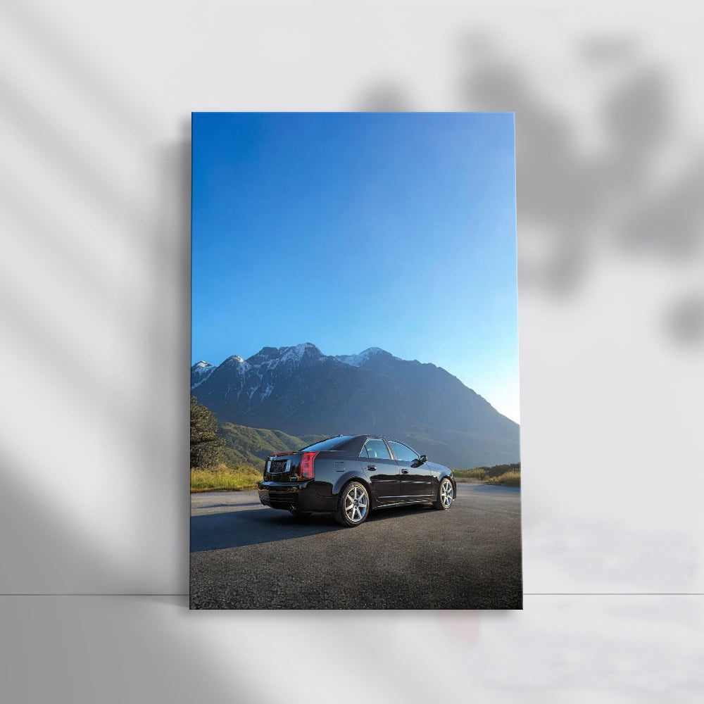 Snowy Mountain Black Cadillac - Elegance in Motion