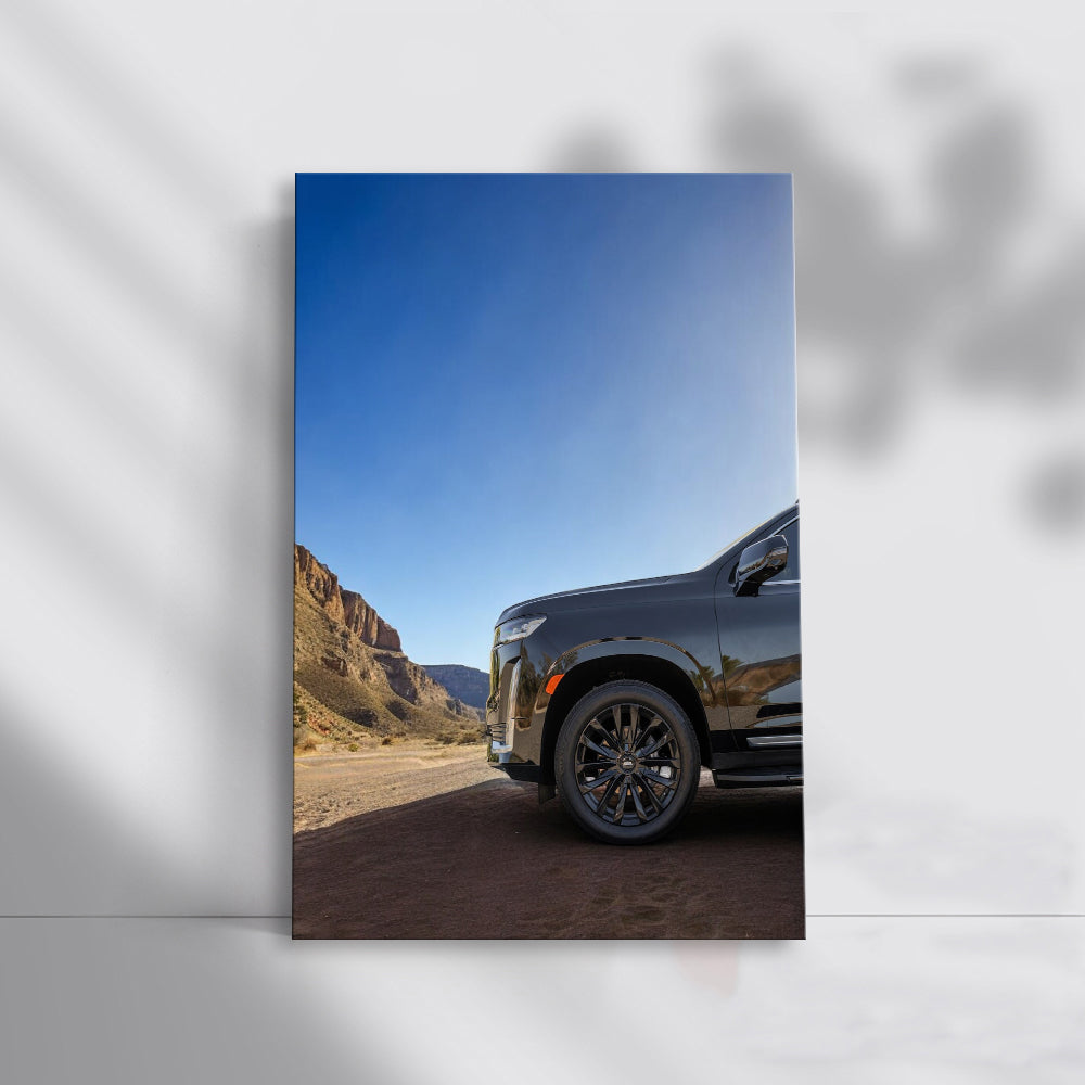 Sleek Black Cadillac Navigates Mountain Roads - Powerful Elegance