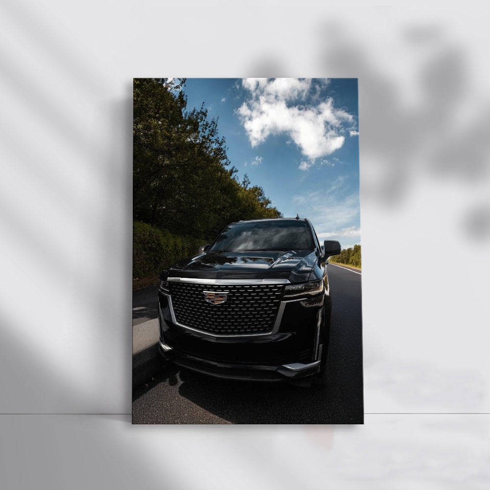 Sleek Black Cadillac Cruising Road - Elegance in Motion