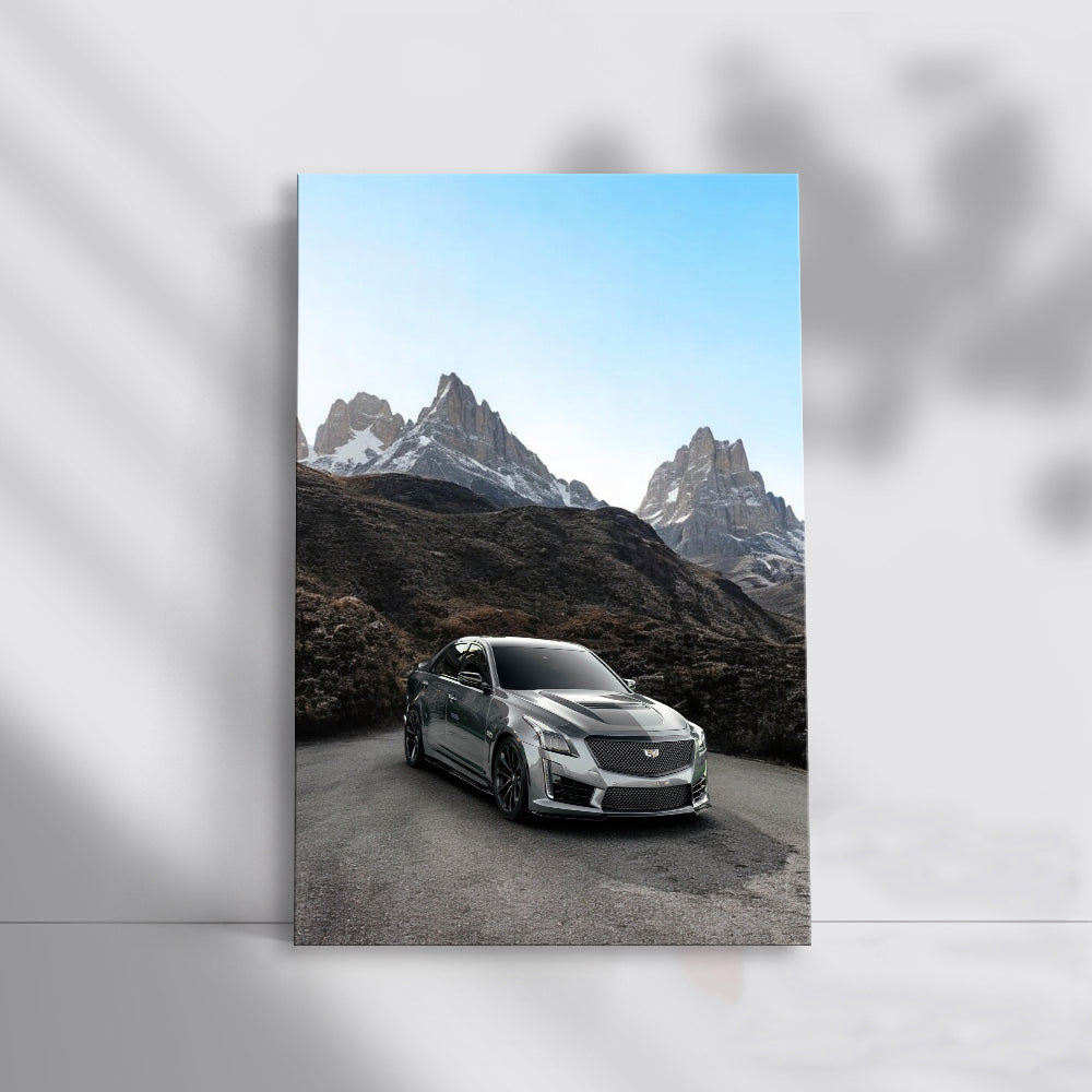 Gray Cadillac with Snowy Mountains - Elegance and Power