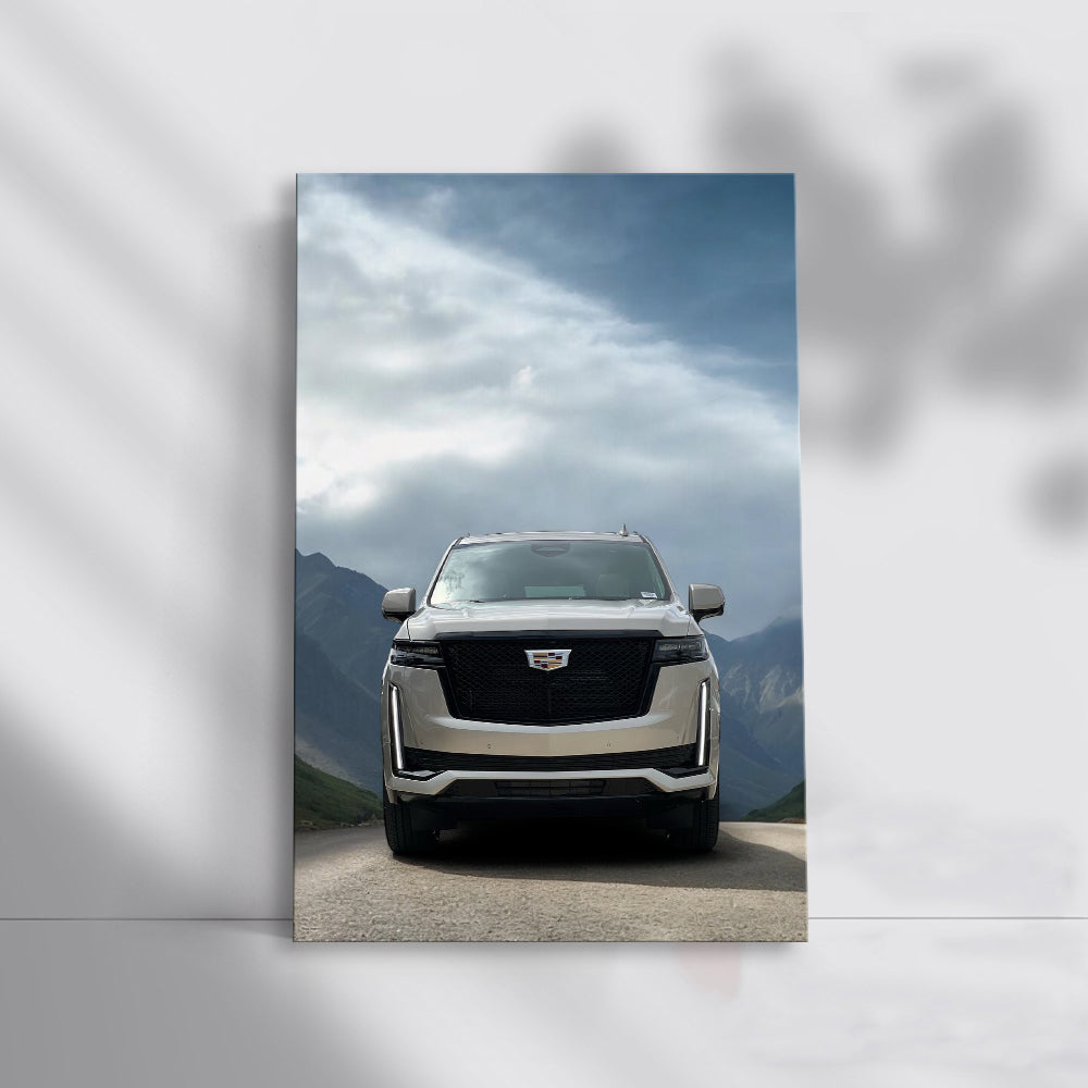 Majestic Cadillac Among Mountain Peaks - Power and Elegance