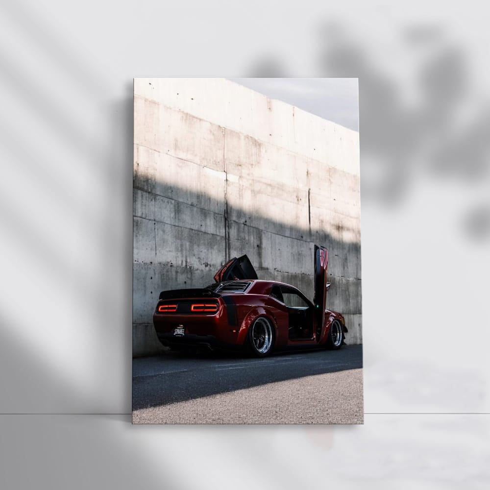 Red Dodge Beside Concrete Wall - Bold and Powerful Ride