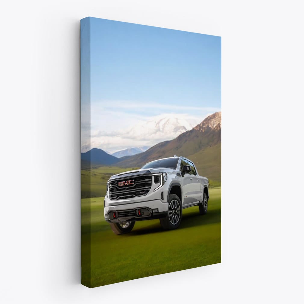 GMC Sierra on Green Lawn, Majestic Mountains Behind - Rugged Power