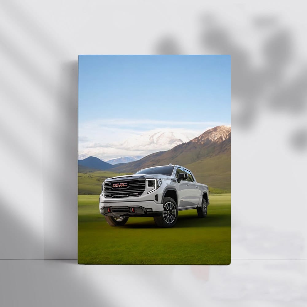 GMC Sierra on Green Lawn, Majestic Mountains Behind - Rugged Power