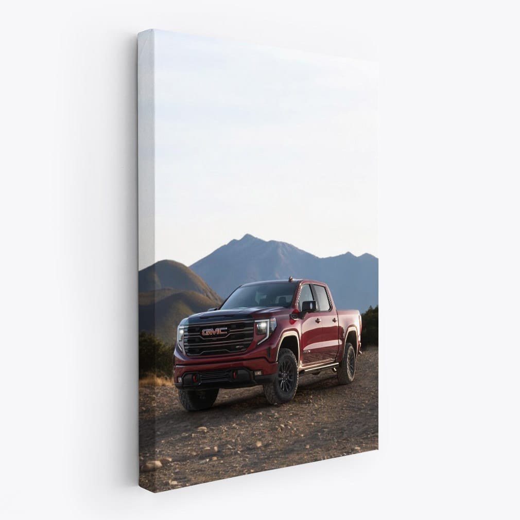 GMC Sierra Navigating Rocky Terrain, Majestic Mountains Behind