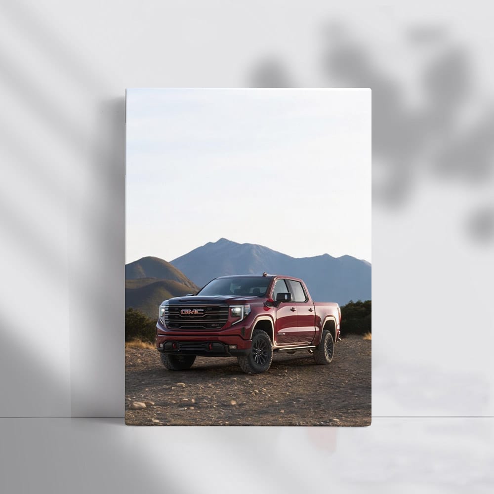 GMC Sierra Navigating Rocky Terrain, Majestic Mountains Behind