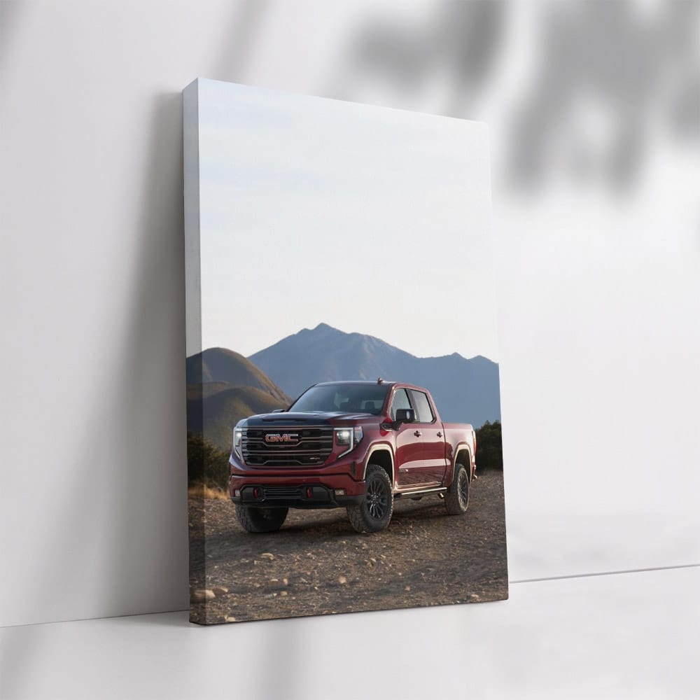 GMC Sierra Navigating Rocky Terrain, Majestic Mountains Behind