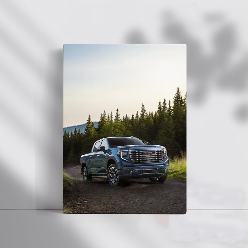 GMC Sierra Tackles Rocky Path, Majestic Pines Behind - Rugged Elegance