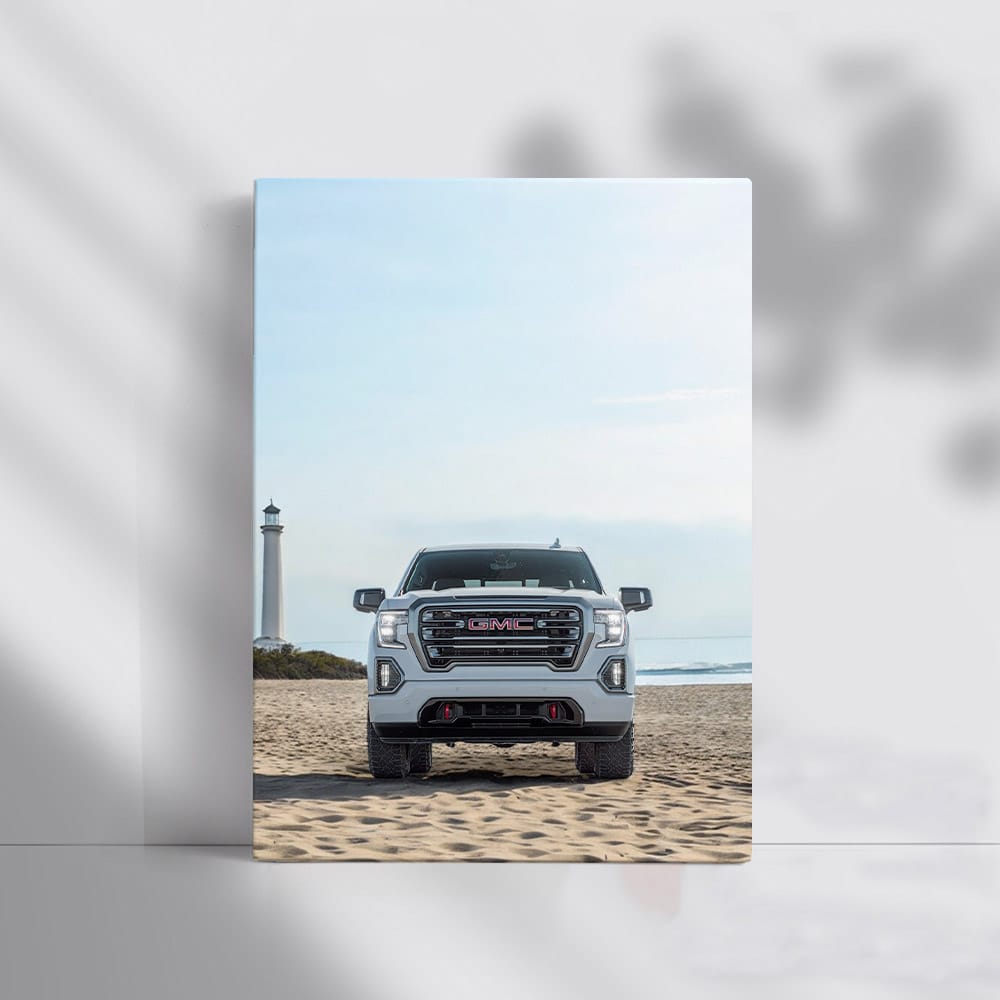 GMC Sierra on Beach with Lighthouse - Rugged Adventure