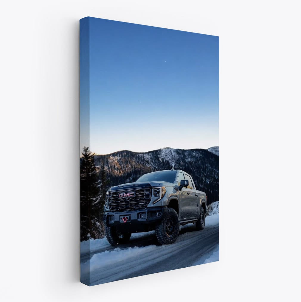 GMC Sierra Navigating Snowy Mountain Road under Starry Sky - Rugged and Reliable