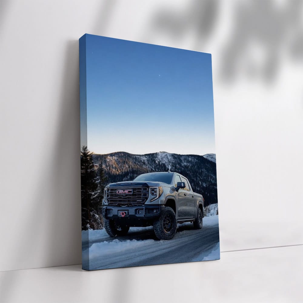 GMC Sierra Navigating Snowy Mountain Road under Starry Sky - Rugged and Reliable