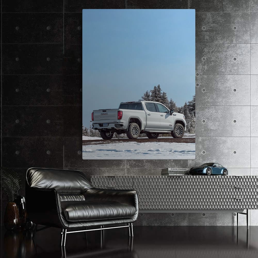 GMC Sierra Navigates Snowy Path Under Clear Blue Sky - Rugged Elegance