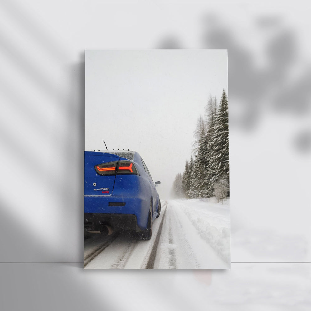 Blue Mitsubishi Lancer in Snow - Adventure Awaits