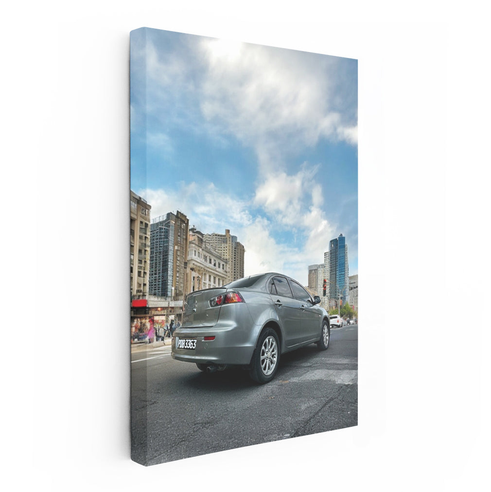 Gray Mitsubishi Lancer Cruising Through Urban Streets - Sleek