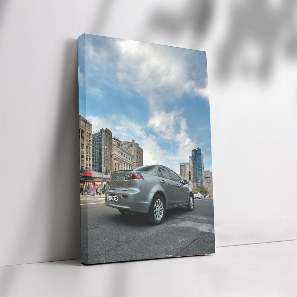 Gray Mitsubishi Lancer Cruising Through Urban Streets - Sleek
