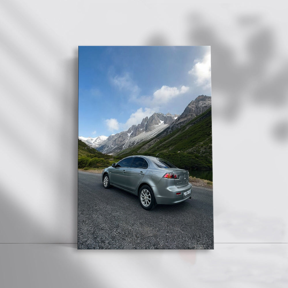 Grey Mitsubishi Lancer in Mountainous Terrain - Rugged Elegance