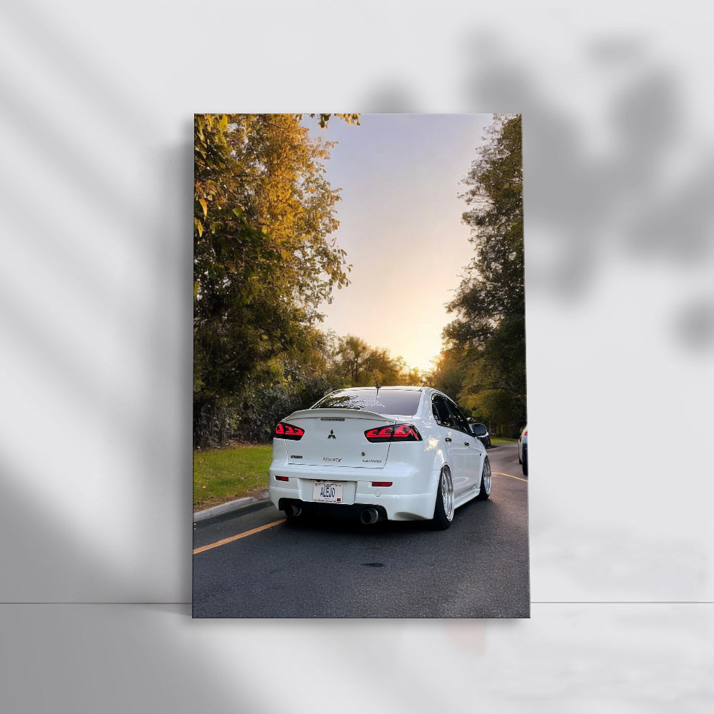 White Mitsubishi Lancer at Sunset - Sporty Elegance