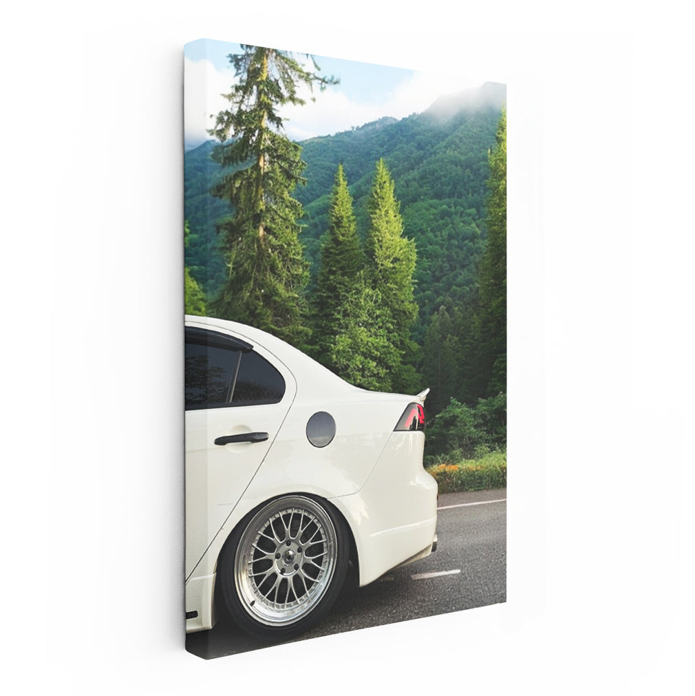 White Mitsubishi Lancer in Mountain Terrain - Adventure Awaits