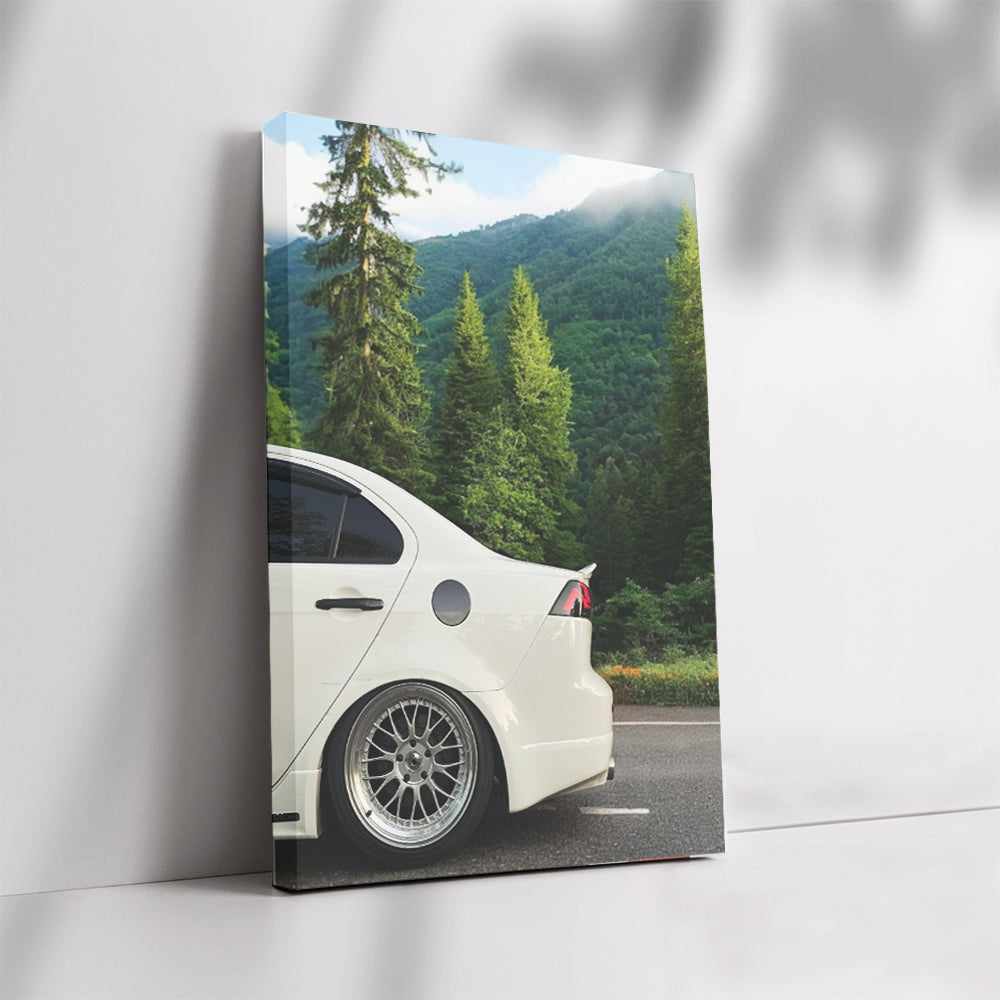 White Mitsubishi Lancer in Mountain Terrain - Adventure Awaits