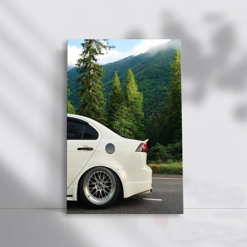 White Mitsubishi Lancer in Mountain Terrain - Adventure Awaits