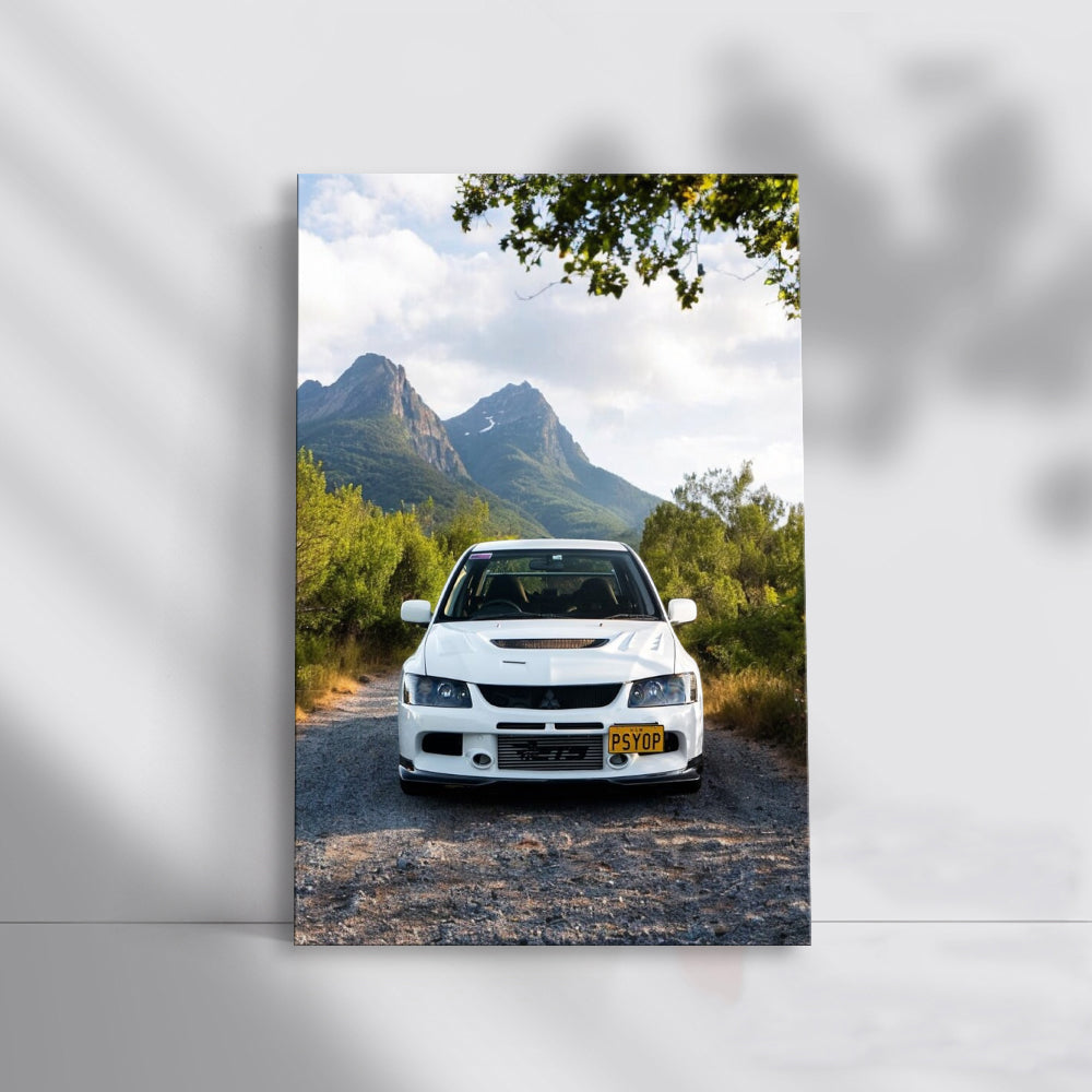 White Mitsubishi Lancer in Mountainous Terrain - Sporty Drive