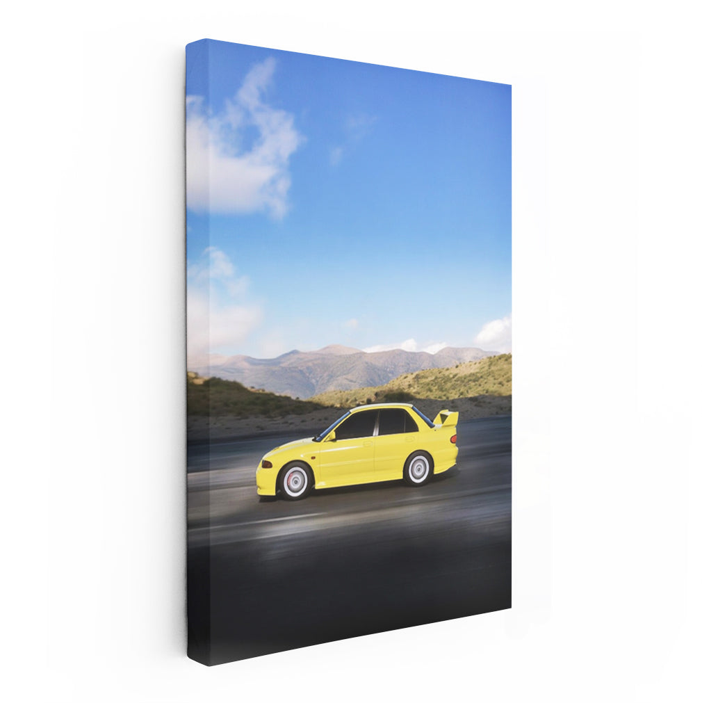 Yellow Mitsubishi Lancer navigating mountain roads - Agile Spirit