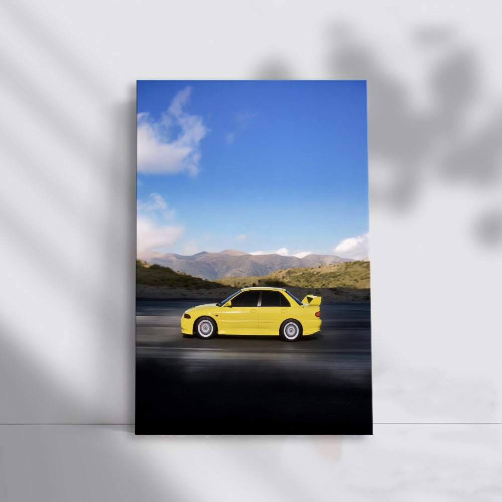 Yellow Mitsubishi Lancer navigating mountain roads - Agile Spirit