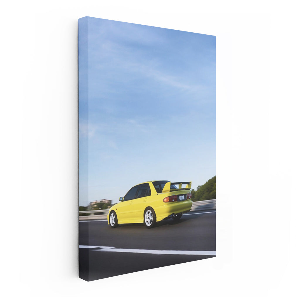 Yellow Mitsubishi Lancer Speeding on Road - Sporty Vibe