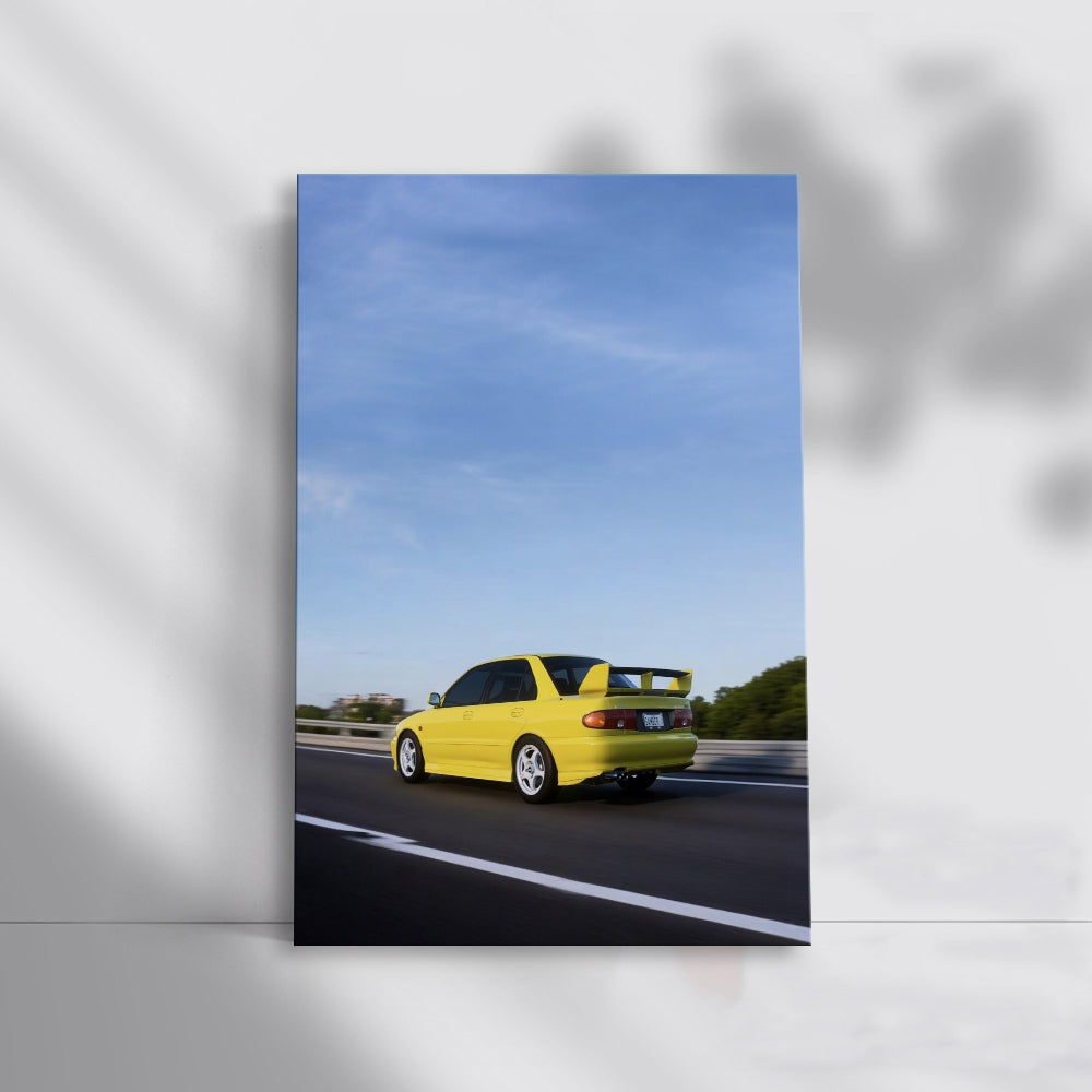 Yellow Mitsubishi Lancer Speeding on Road - Sporty Vibe