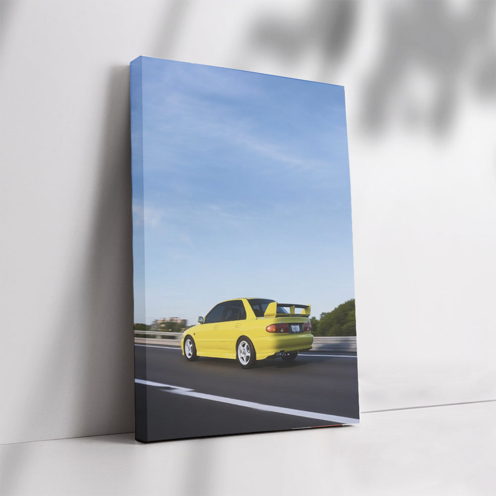 Yellow Mitsubishi Lancer Speeding on Road - Sporty Vibe