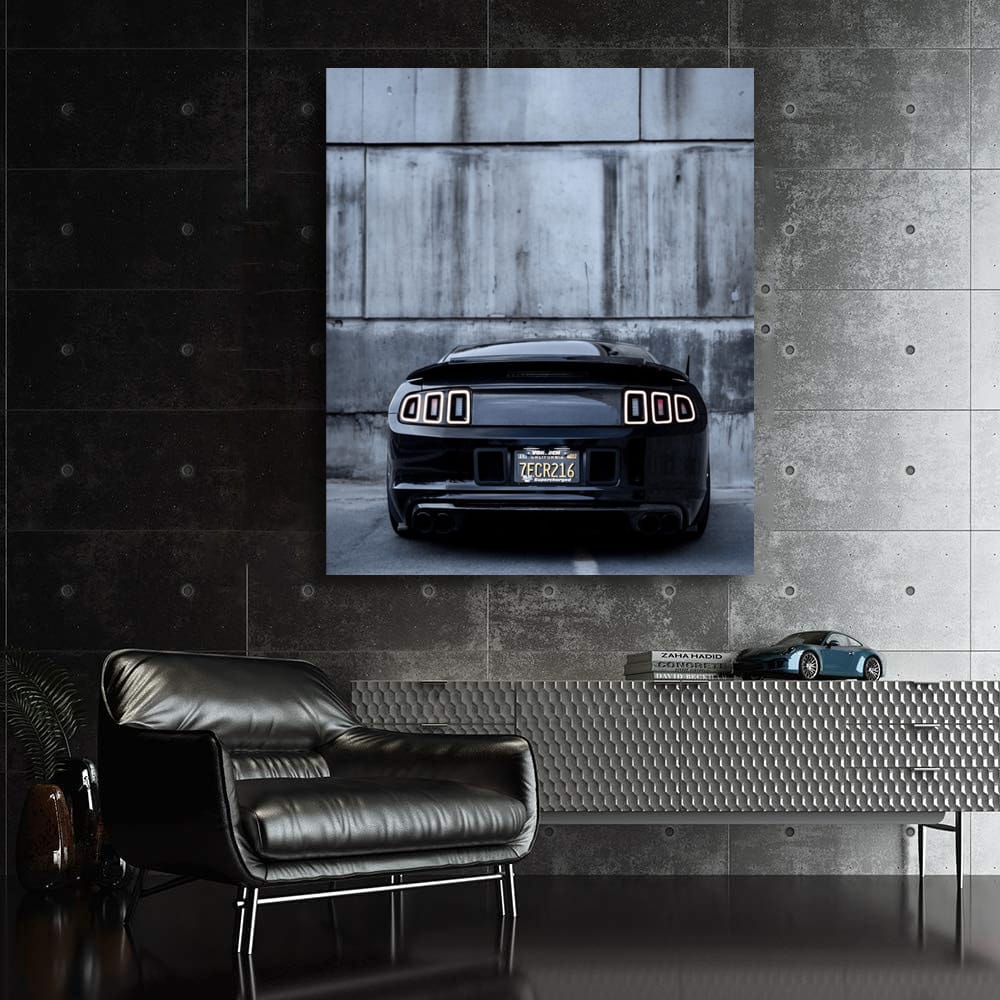 Black Mustang Against Concrete Wall - Bold and Powerful