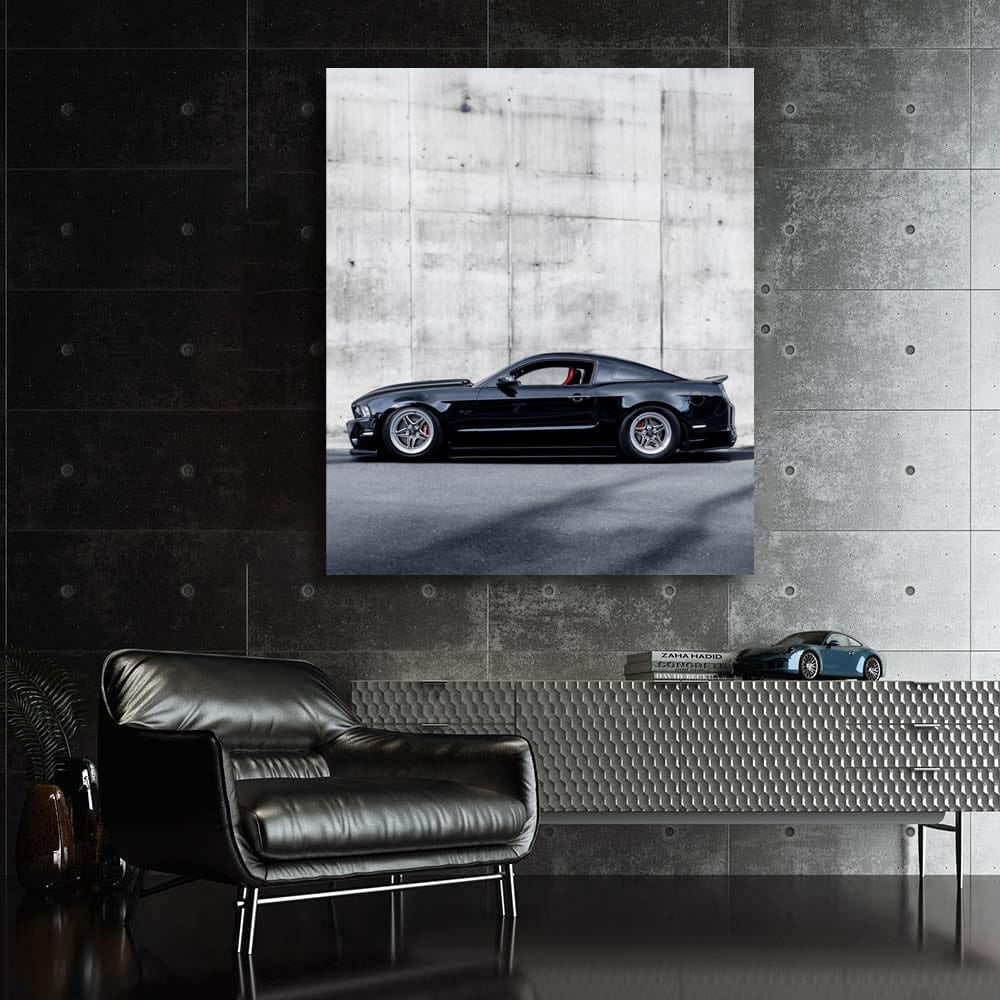 Black Mustang Against Concrete Wall - Bold and Powerful