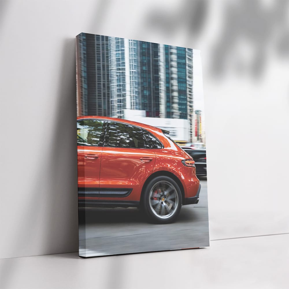 Porsche Macan S in Orange Amidst Skyscrapers - Urban Elegance