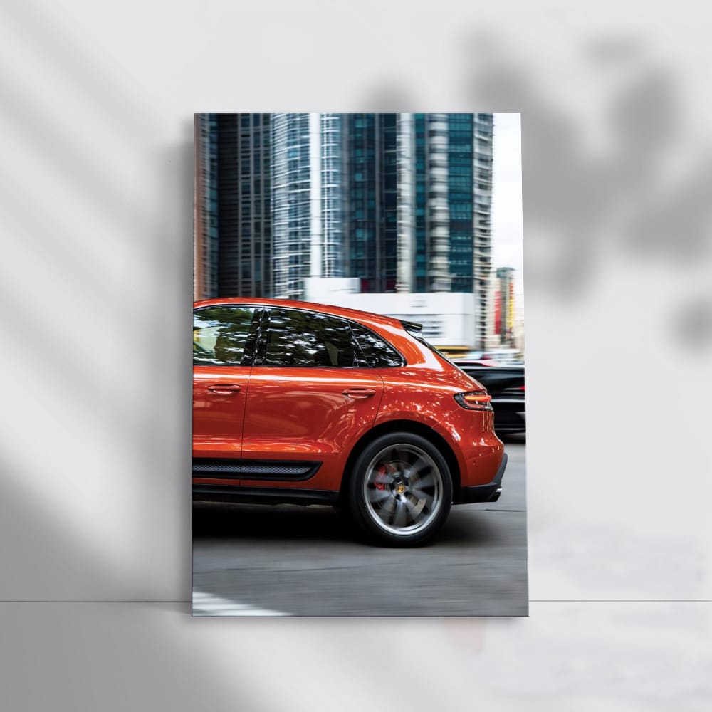 Porsche Macan S in Orange Amidst Skyscrapers - Urban Elegance
