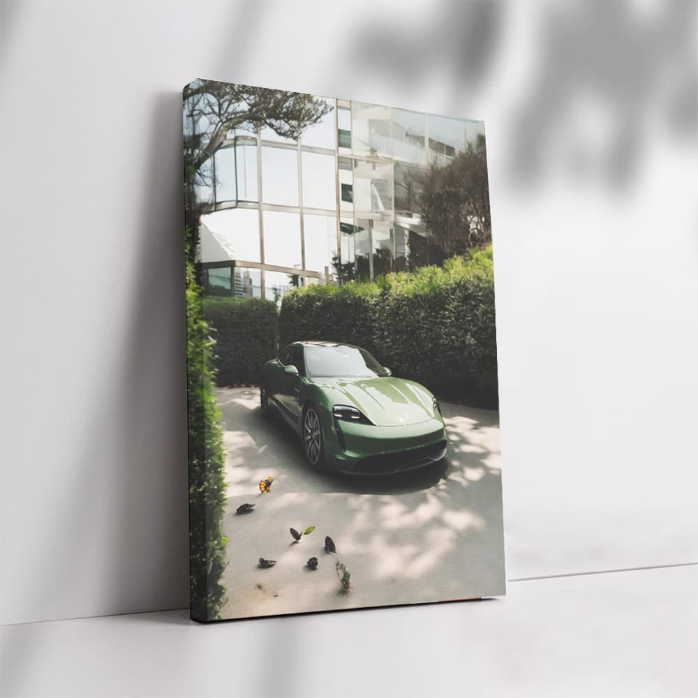 Sleek Porsche in Green by Glass Building - Elegance in Motion