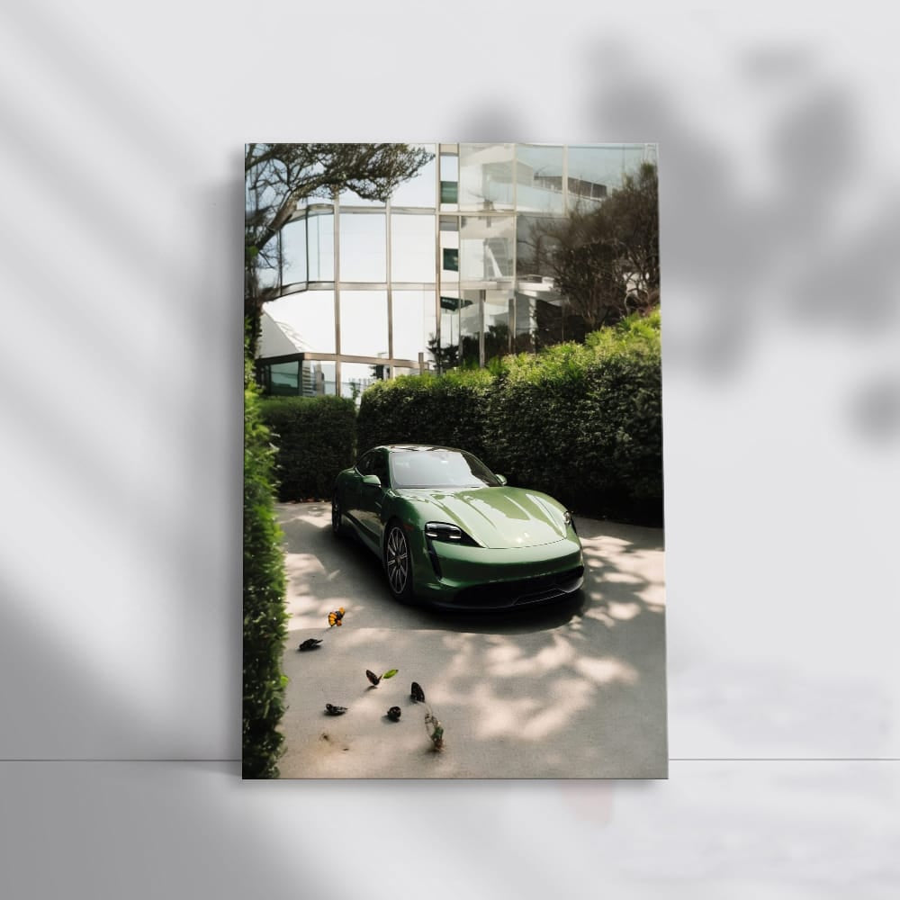 Sleek Porsche in Green by Glass Building - Elegance in Motion