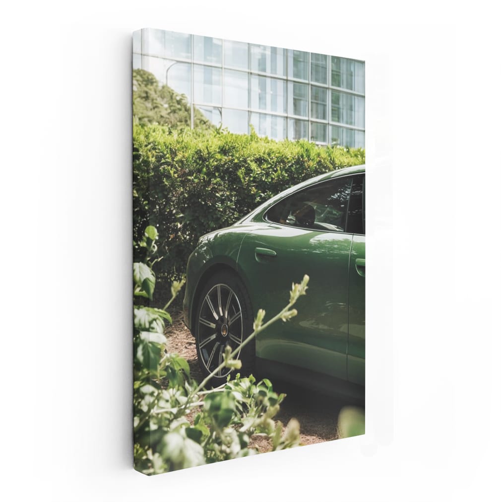 Sleek Green Porsche Parked by Glass Building - Style Meets Speed