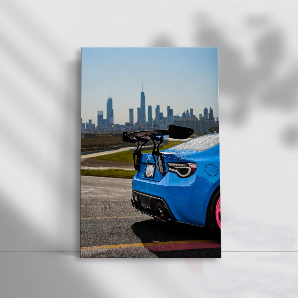 Subaru BRZ in Blue Cruises with Cityscape - Sleek Urban Ride