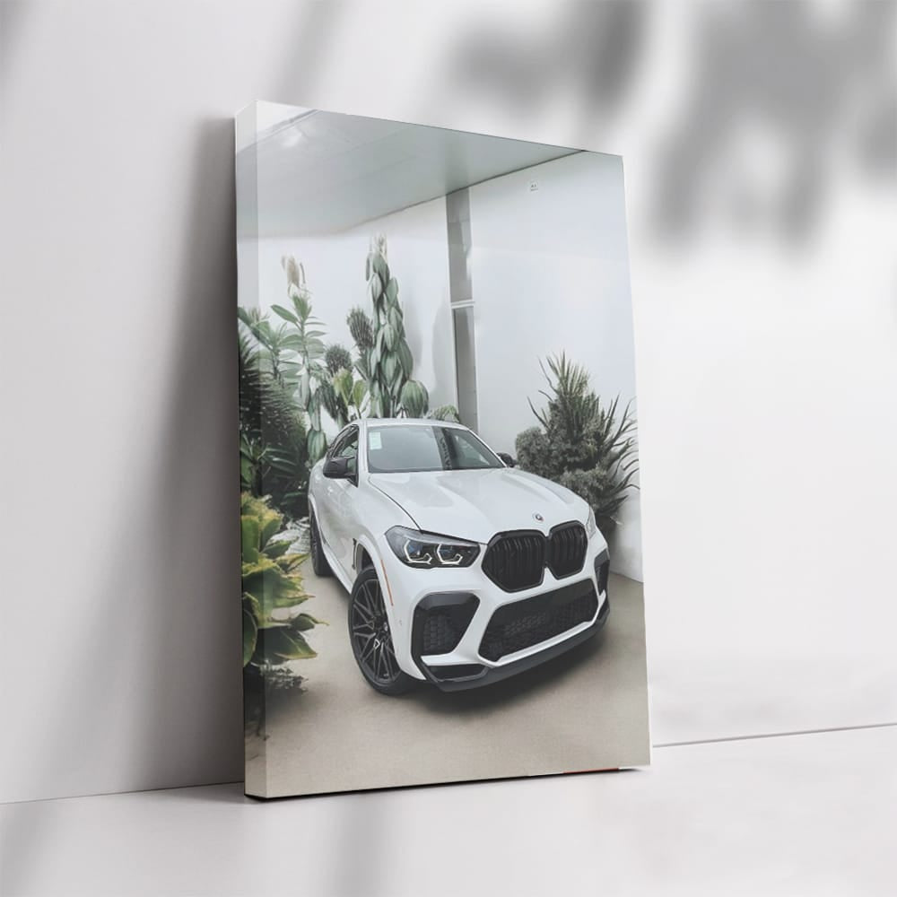 Sleek White BMW X6M Amidst Foliage - Power Meets Elegance