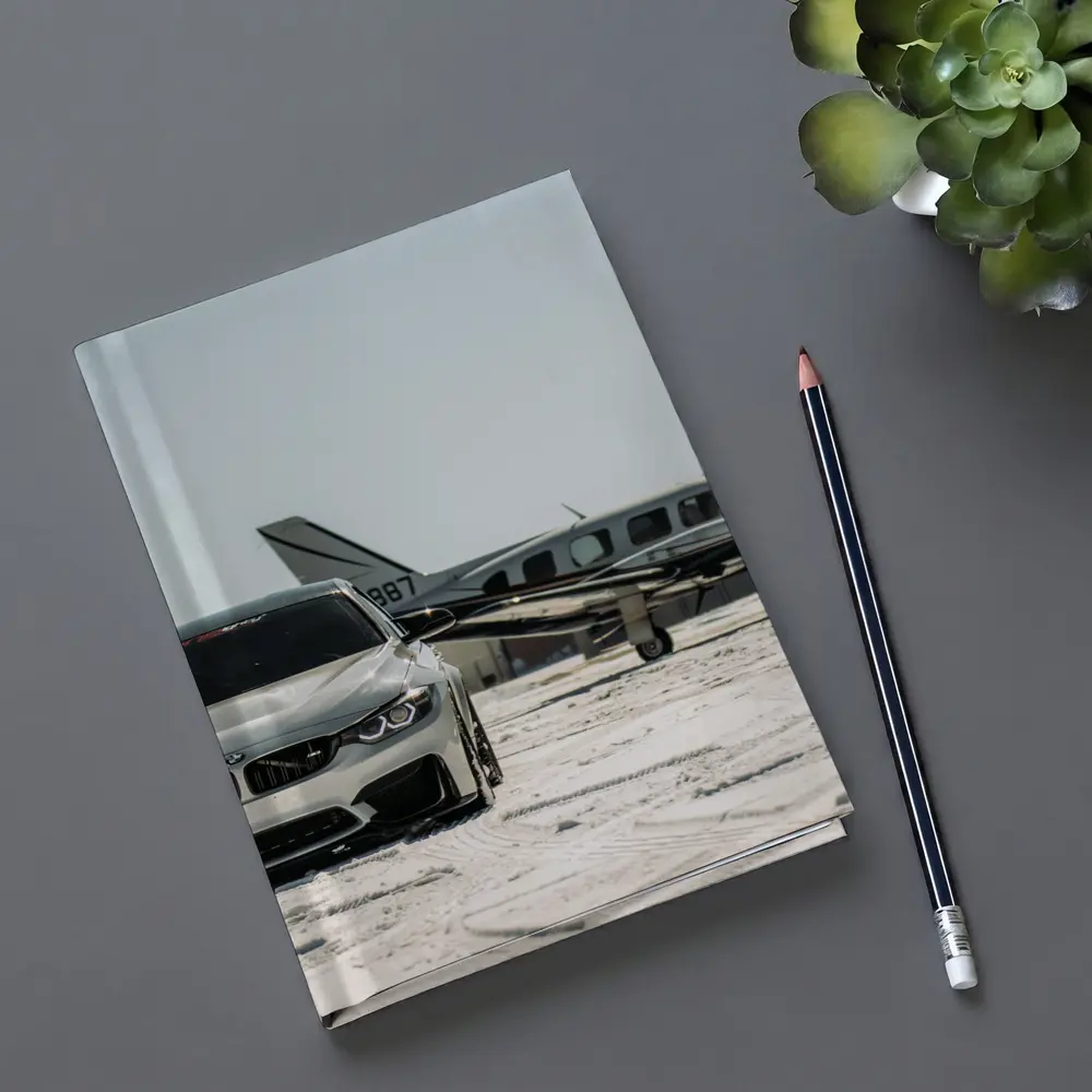 BMW M4 Silver Parked Near Private Jet – Notebooks