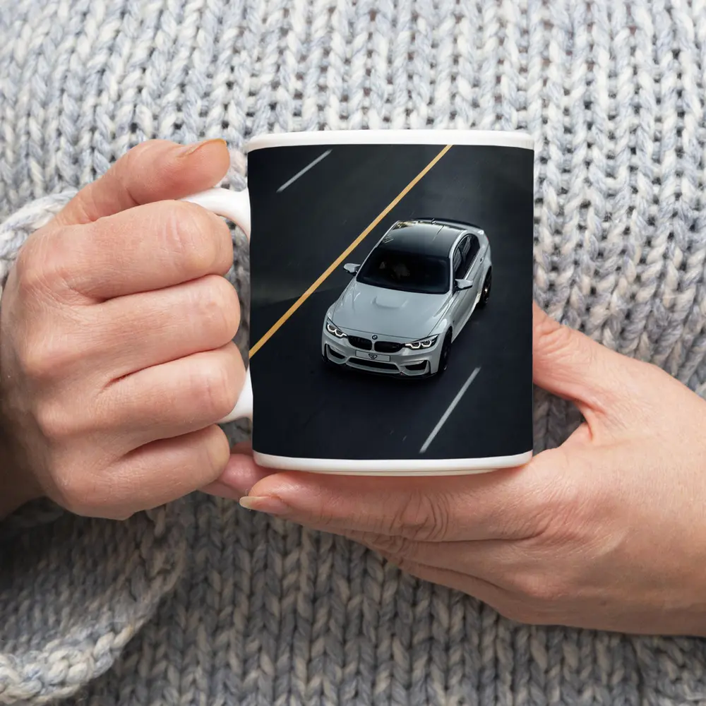 BMW M4 White Sedan on Open Road – Mugs